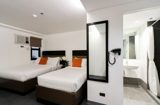30%Off Relaxing Experience in an Executive King or Twin Room for 2 Adults and 2 Kids , Use of Overlooking Rooftop Pool and Gym at Privato Hotel Makati Starting at P1955 instead of P2800